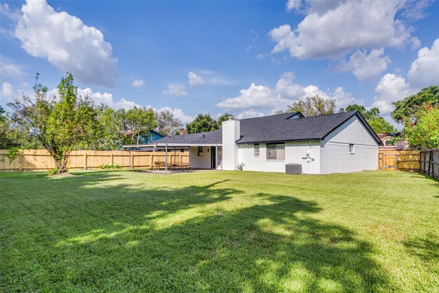 15038 Timberlea Dr, Houston, TX 77489 - back of house featuring a chimney, central air condition unit, a patio, brick siding, and a shingled roof