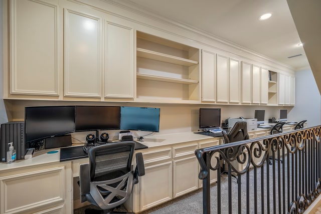 office featuring built in desk and crown molding