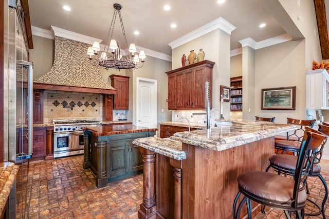 kitchen with a breakfast bar, kitchen peninsula, backsplash, double oven range, and light stone countertops