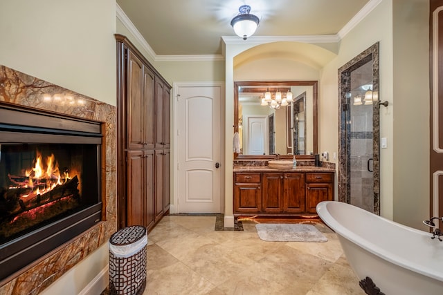 bathroom with vanity, shower with separate bathtub, and ornamental molding