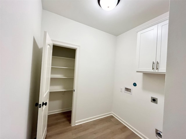 726 Blue Stone Dr, Beasley, TX 77417 - laundry room with hookup for an electric dryer, wood finished floors, washer hookup, and cabinet space