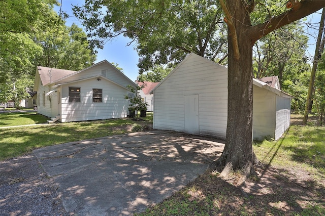 view of side of property with a yard