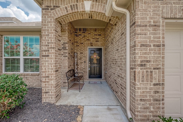 entrance to property featuring a garage