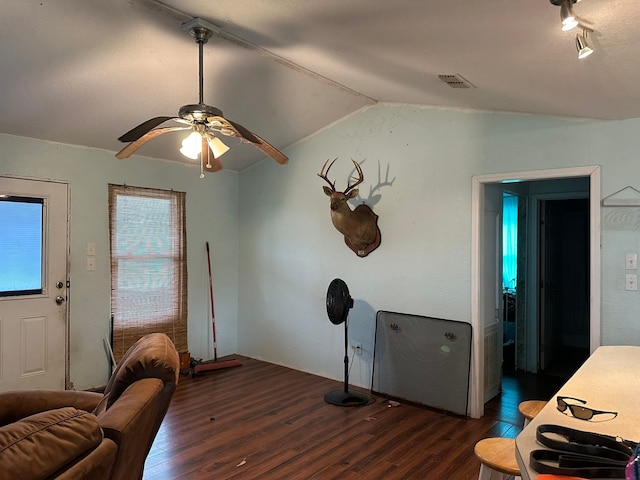 interior space with lofted ceiling, ceiling fan, and dark hardwood / wood-style flooring