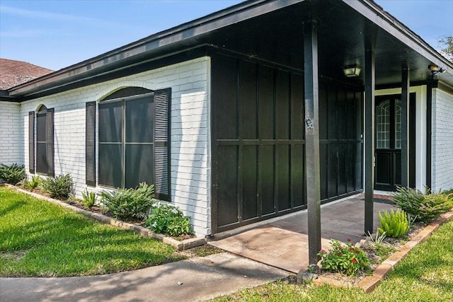 view of home's exterior with brick siding