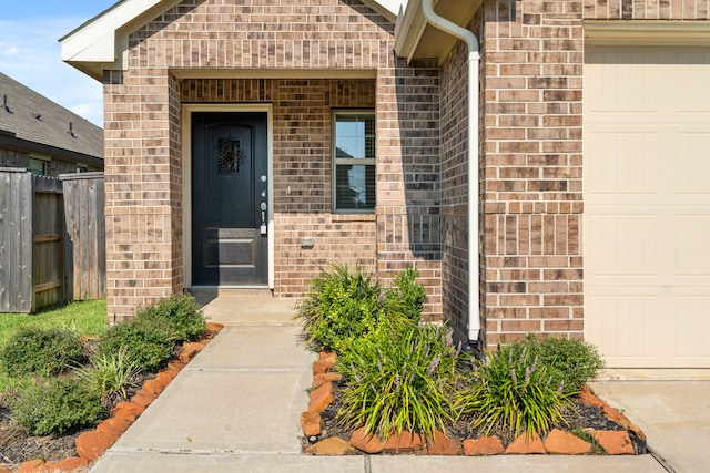 view of exterior entry featuring a garage