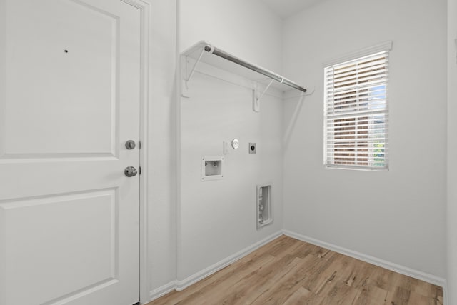 laundry room with hookup for a washing machine, light hardwood / wood-style flooring, hookup for a gas dryer, and electric dryer hookup