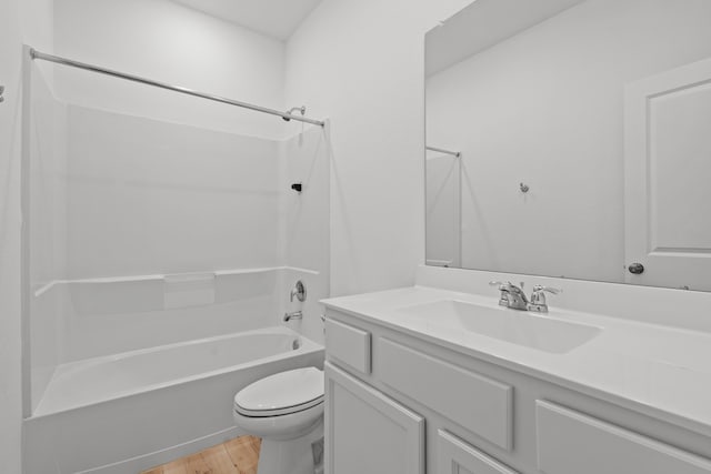 full bathroom with vanity, toilet, shower / tub combination, and wood-type flooring