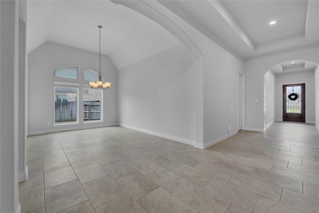 interior space featuring a notable chandelier, light tile patterned floors, and a wealth of natural light