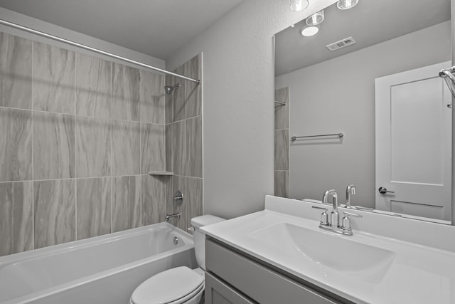 full bath with toilet, bathtub / shower combination, visible vents, and vanity