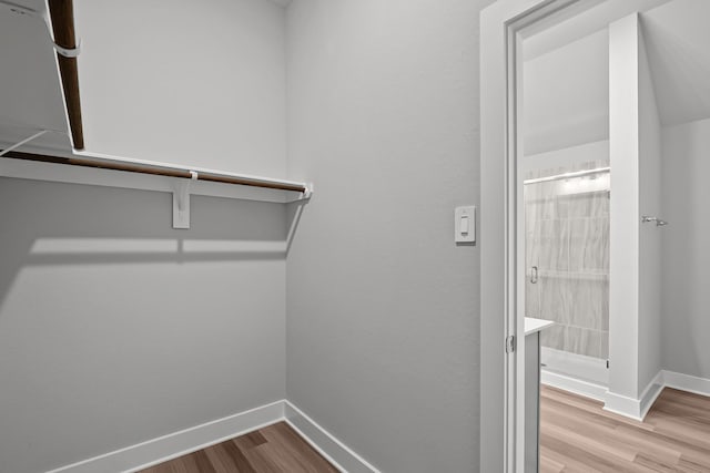 spacious closet with wood finished floors