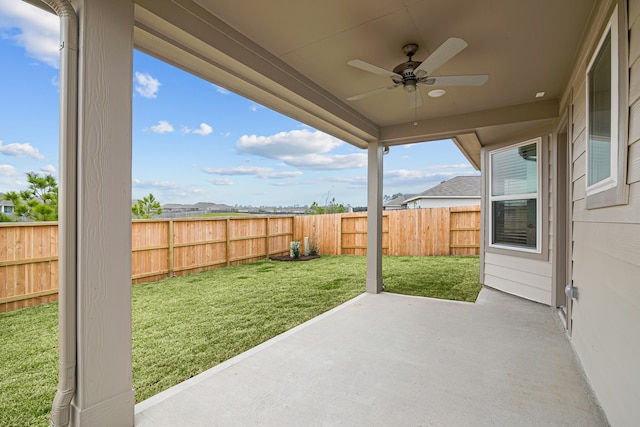 view of patio with a fenced backyard and a ceiling fan