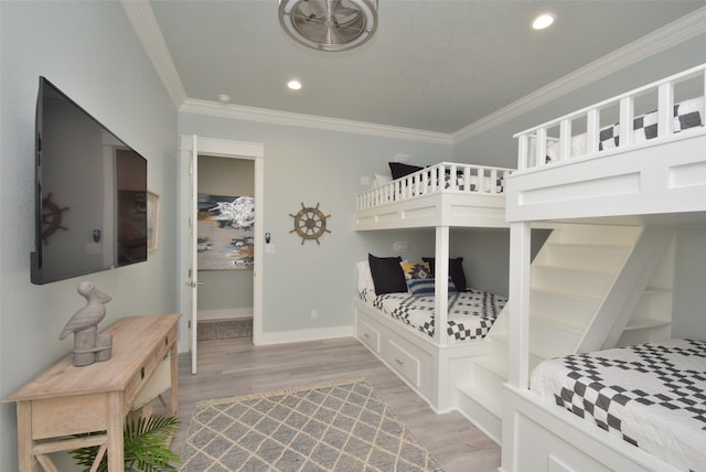 bedroom featuring light hardwood / wood-style floors and ornamental molding