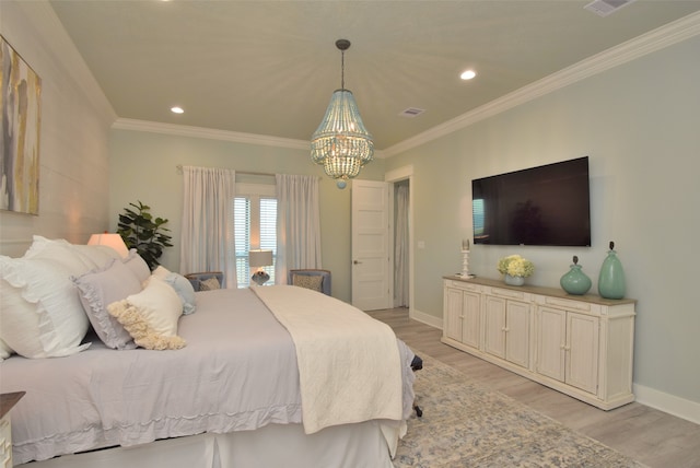 bedroom featuring an inviting chandelier, light hardwood / wood-style floors, and ornamental molding