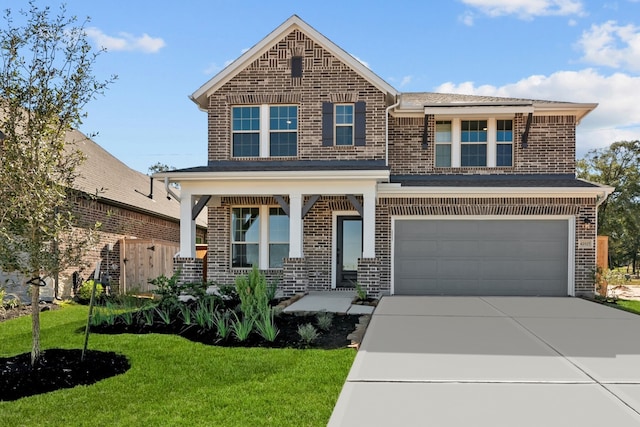 view of front of house with a front lawn and a garage