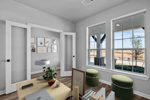 office space featuring french doors and hardwood / wood-style floors