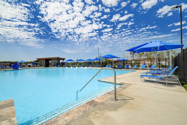 view of swimming pool featuring a patio area