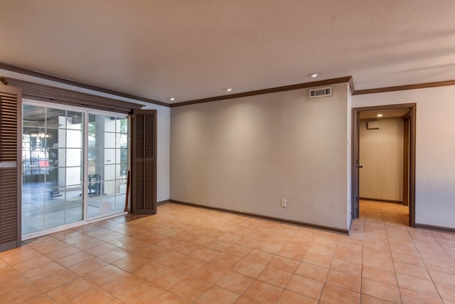 tiled empty room featuring ornamental molding