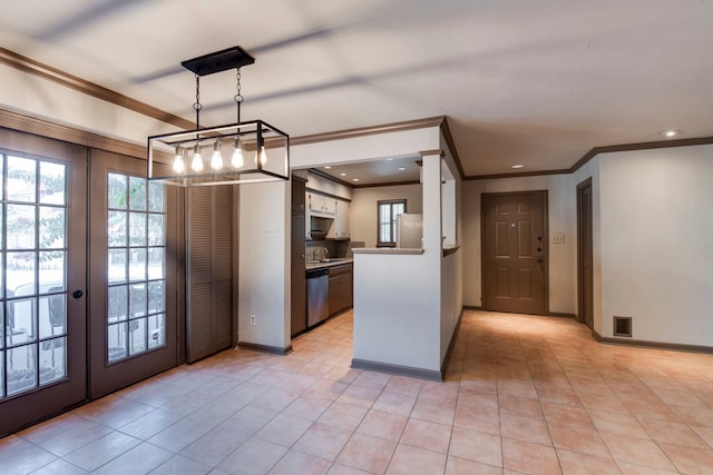 kitchen with pendant lighting, appliances with stainless steel finishes, french doors, and light tile patterned floors