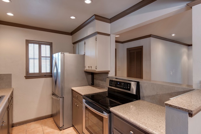 kitchen with crown molding, appliances with stainless steel finishes, backsplash, and light tile patterned floors