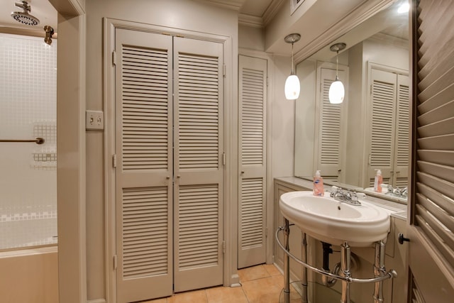 bathroom with sink, crown molding, and tile patterned floors