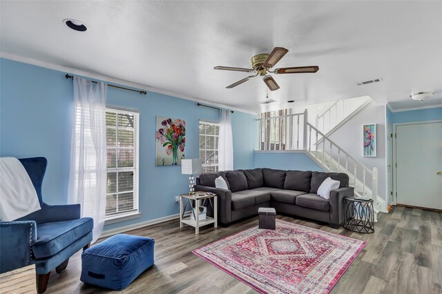 living room featuring ceiling fan, hardwood / wood-style floors, and ornamental molding