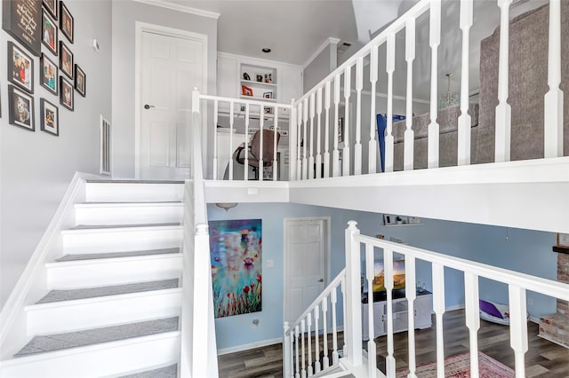 stairs featuring hardwood / wood-style floors