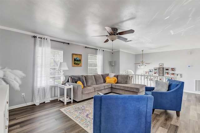 living room featuring crown molding, hardwood / wood-style floors, and ceiling fan