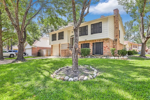 raised ranch featuring a garage and a front yard