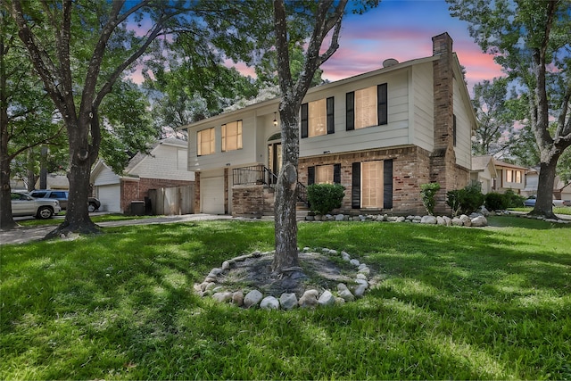 bi-level home featuring a yard