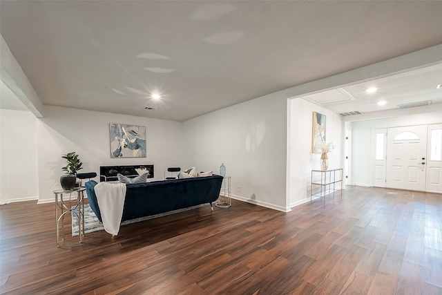 living room featuring dark hardwood / wood-style flooring