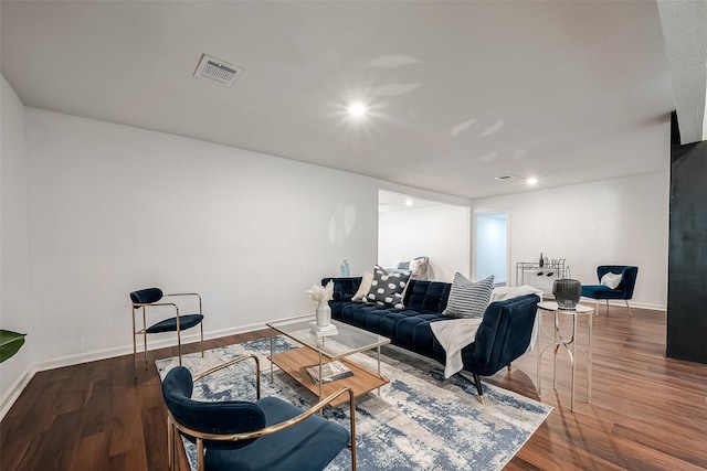 living room featuring dark wood-type flooring