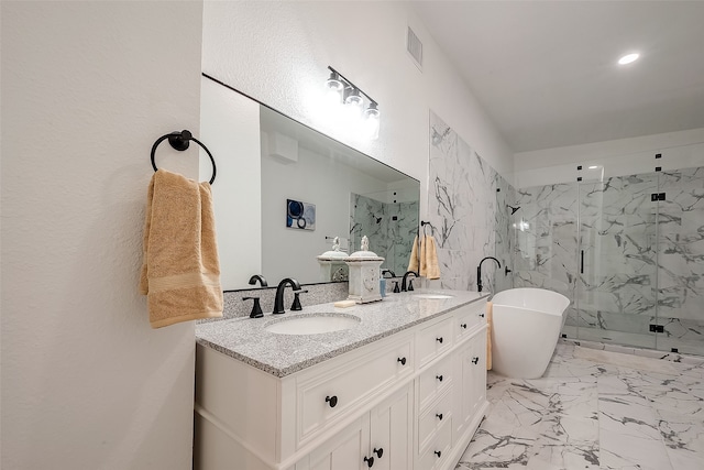 bathroom featuring vanity and shower with separate bathtub