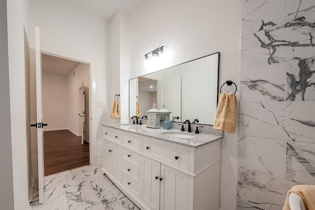 bathroom featuring vanity and hardwood / wood-style flooring