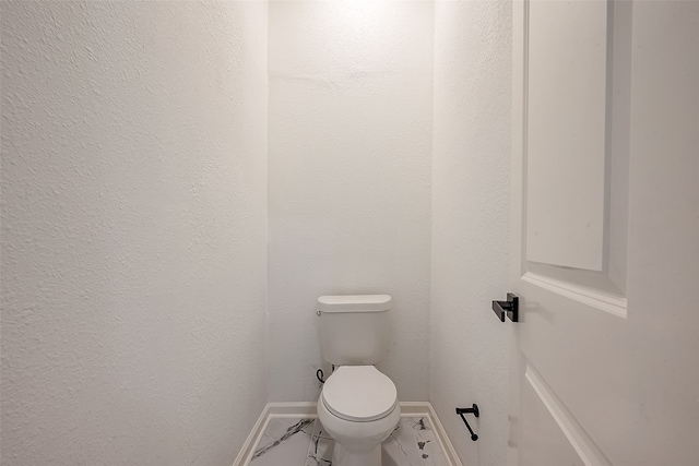 bathroom featuring toilet