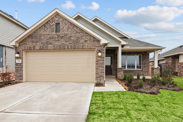 view of front of house featuring a garage, a front yard, concrete driveway, and brick siding