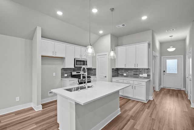 kitchen with white cabinetry, visible vents, and appliances with stainless steel finishes