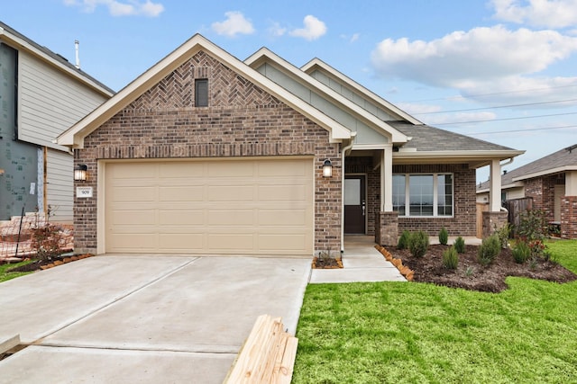 view of front of home with brick siding, a shingled roof, concrete driveway, an attached garage, and a front lawn