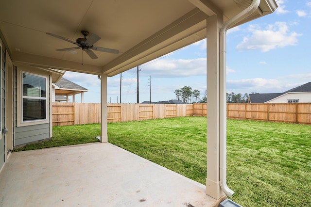 view of patio with a fenced backyard and a ceiling fan