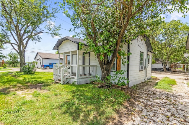 view of property exterior featuring a lawn