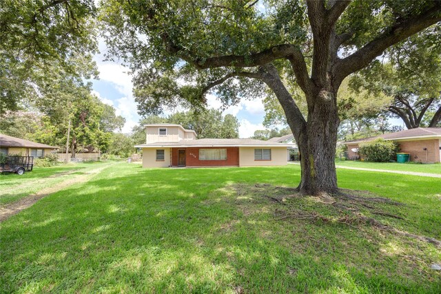 view of front of home with a front yard