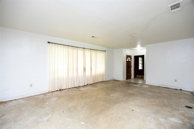 spare room with concrete floors