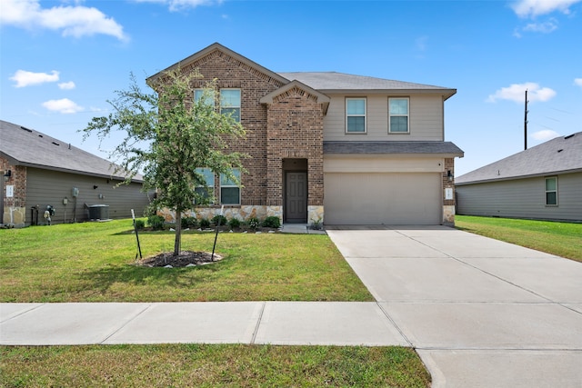 view of front of home with a garage and a front lawn