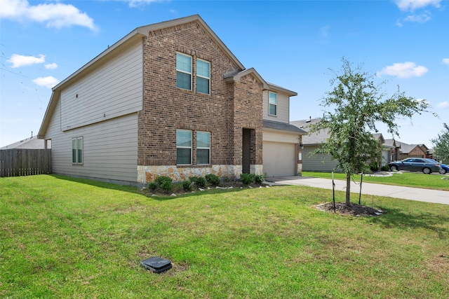 view of front of property with a garage and a front yard