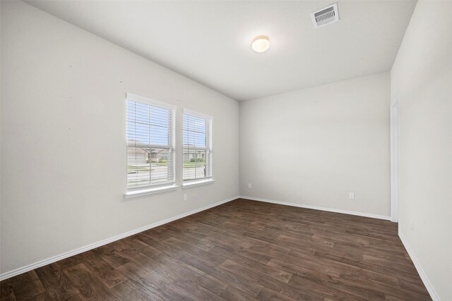 unfurnished room featuring hardwood / wood-style floors