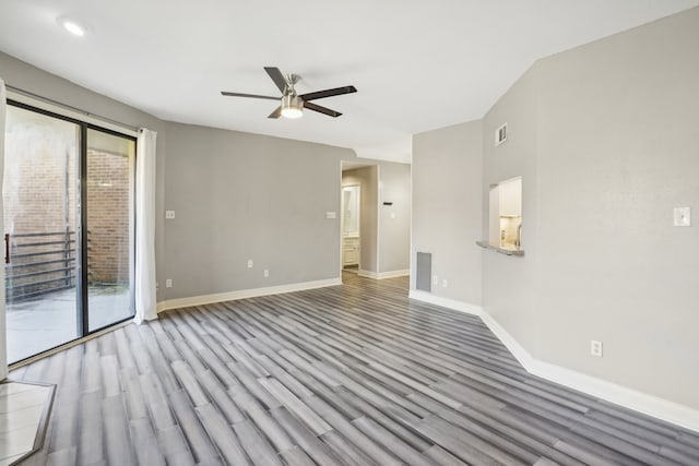 spare room with ceiling fan and light wood-type flooring