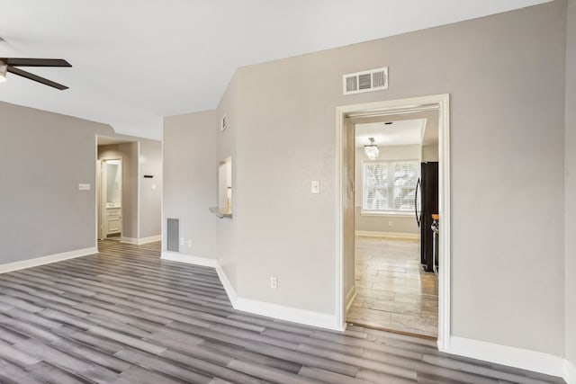 unfurnished room featuring wood-type flooring and ceiling fan