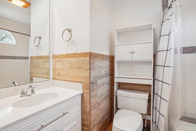 bathroom featuring tile walls, vanity, a shower with curtain, and toilet