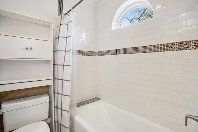 bathroom with toilet and shower / tub combo with curtain