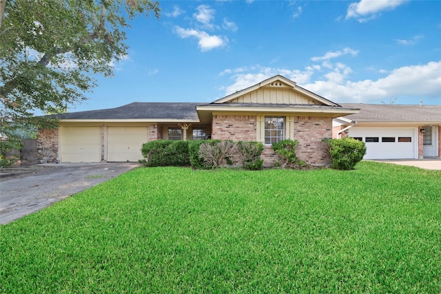 single story home with a front lawn and a garage